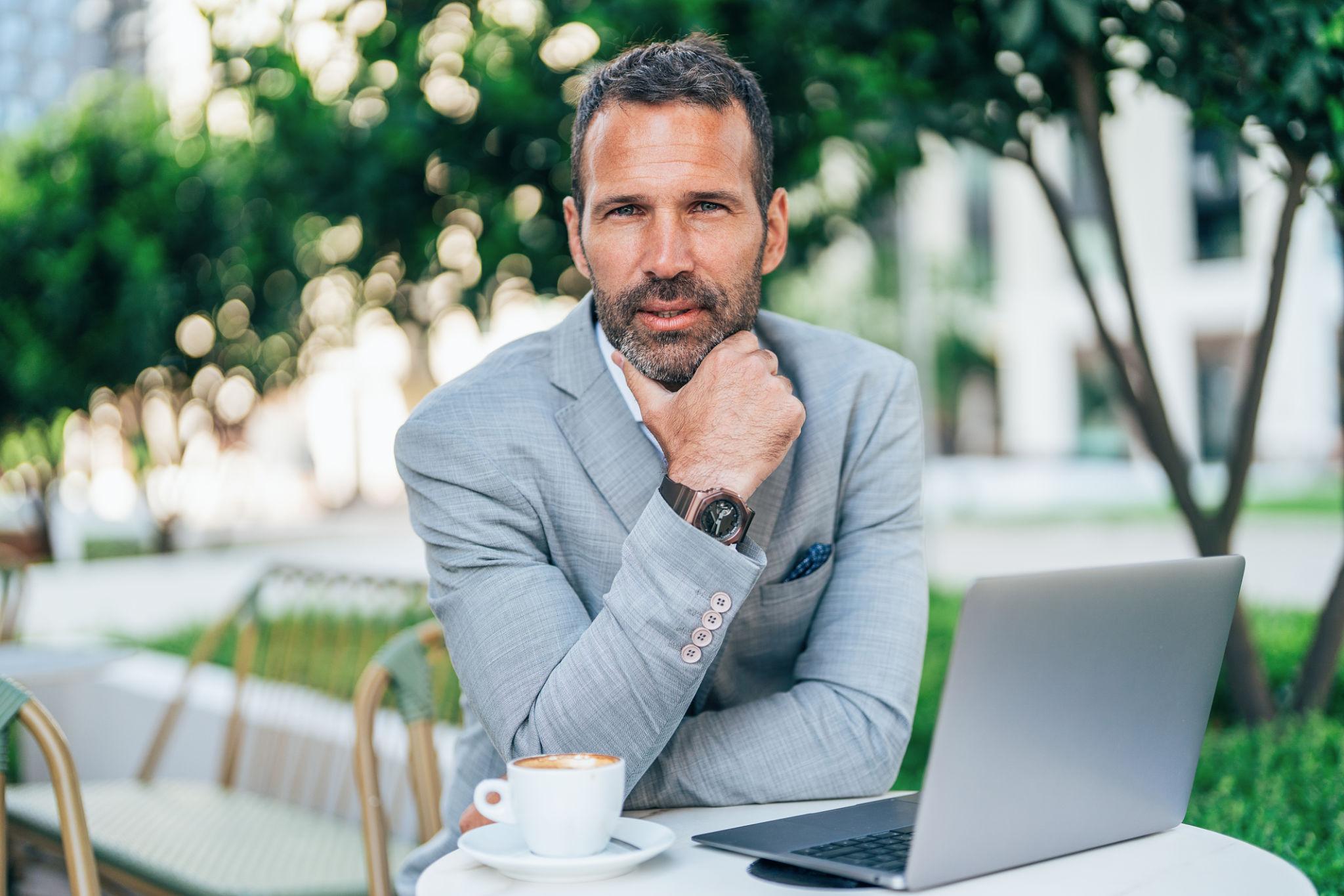 Middle-aged professional reflecting on career rebuilding and new opportunities after addiction recovery.